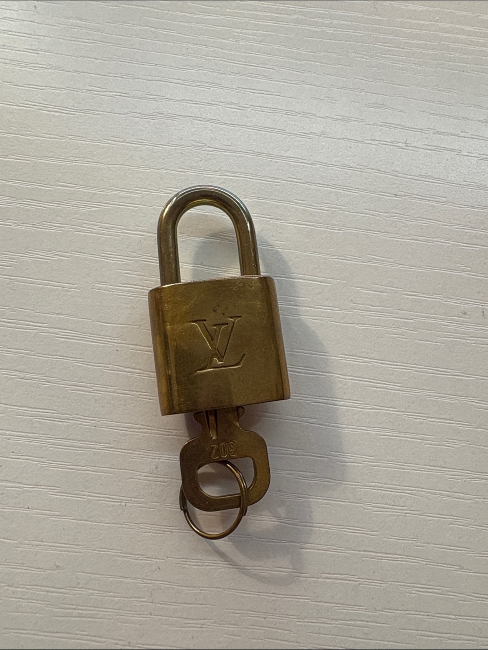 Louis Vuitton Brass Padlock and Key Set in Antique Gold-Tone
